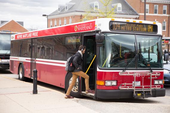 Student boarding shuttle bus