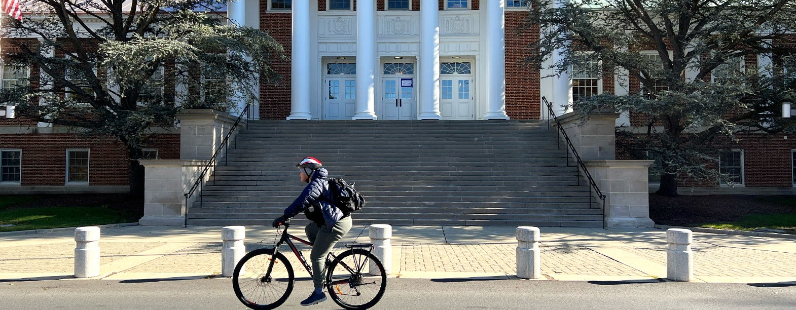 bicyclist in front of Admin building