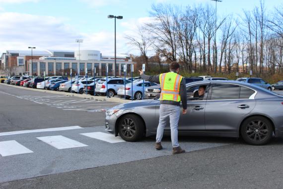 Parking attendant directing traffic